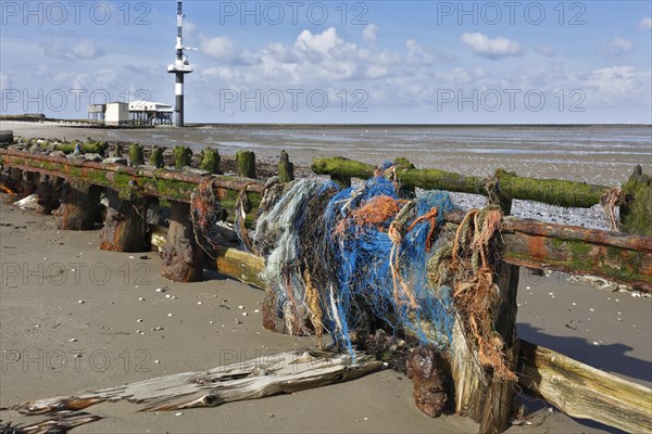 Remains of fishing nets in dilapidated railway tracks on the Minsener Oog power station