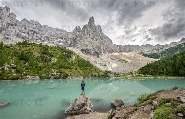 Young man standing on stone