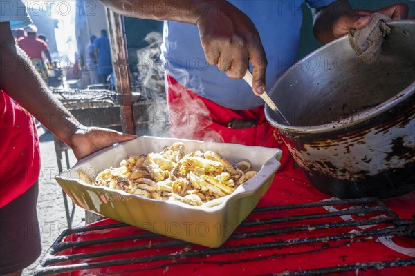 Freshly cooked seafood put on the platter in restaurant of Maputo