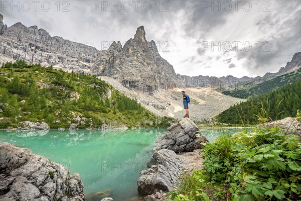 Young man standing on stone