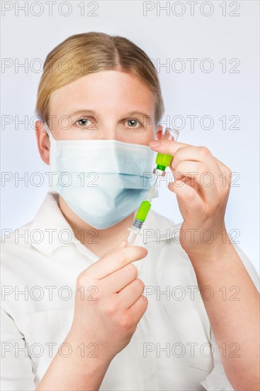 Doctor with syringe and vaccine