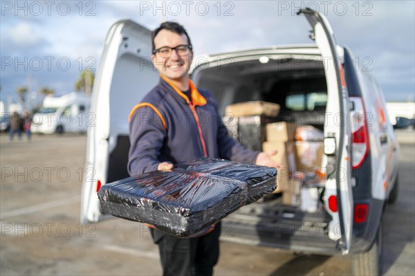 Delivery man handing out a parcel