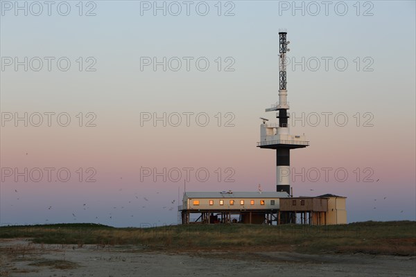 Radar tower on the Minsener Oog power plant in the evening light