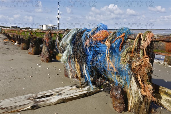 Remains of fishing nets in dilapidated railway tracks on the Minsener Oog power station