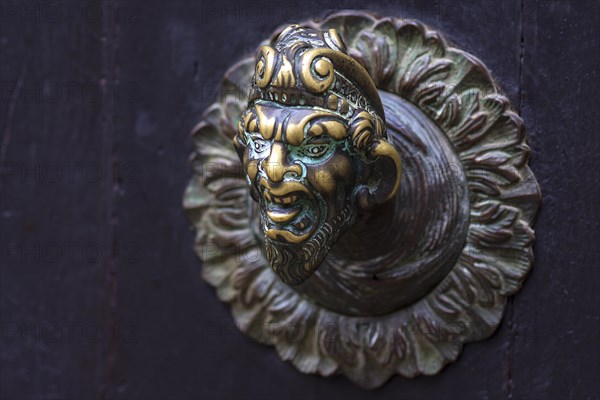 Male bronze figure as doorknob