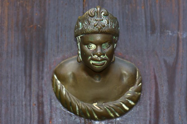 Male bronze figure as doorknob