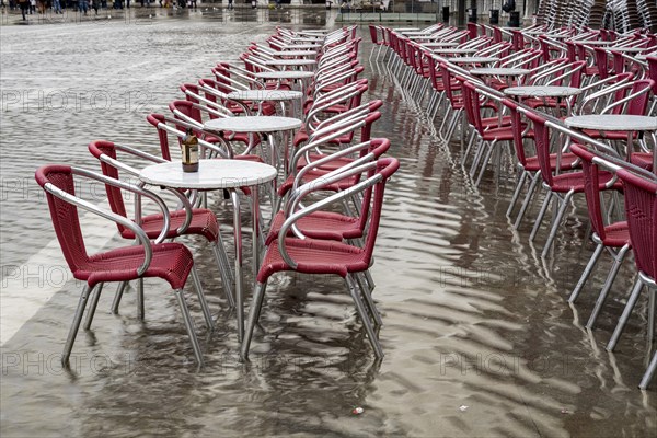 Tables and chairs are in the water at Acqua alta