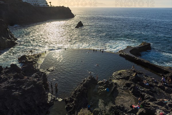 Natural pool in the Atlantic ocean at sunset