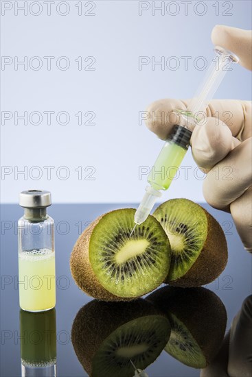 Liquid is injected into a kiwi