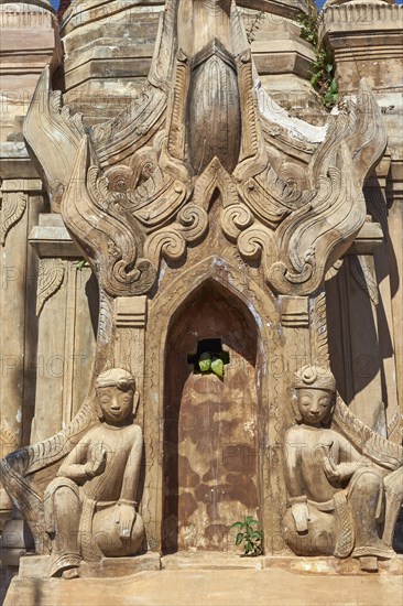 Guardian figures at tomb stupas