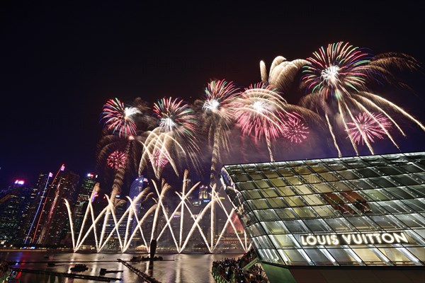 Fireworks over the Marina Bay Sands Reservoir with Louis Vuitton Shopping Mall