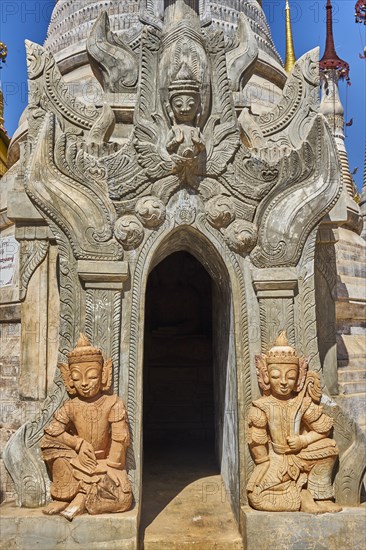Guardian figures at tomb stupas