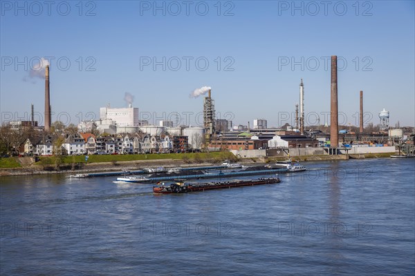 Freight ships sail on the Rhine near Duisburg-Homberg