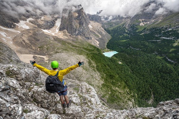 Young man puts his hands in the air