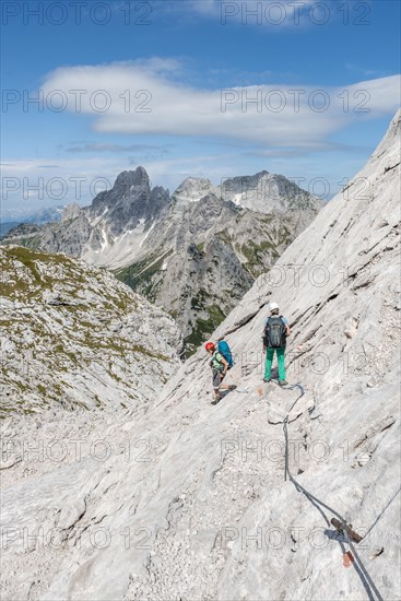 Mountaineer on marked secured route from Simonyhuette to Adamekhuette