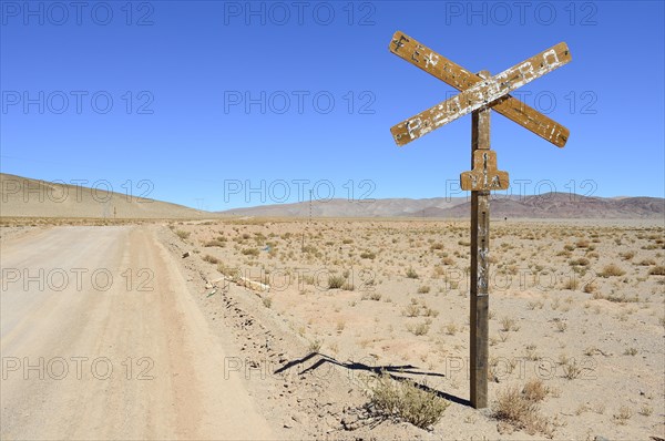 Weathered sign level crossing