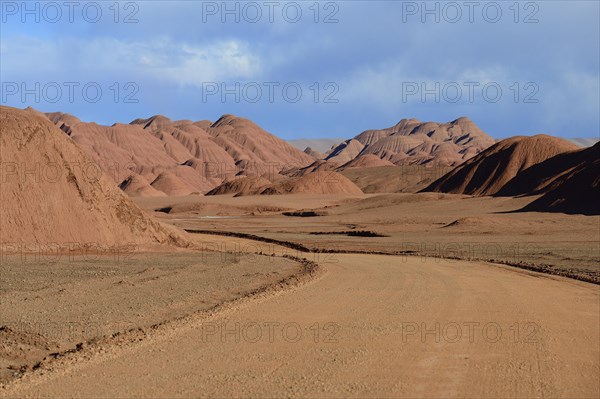 Road through red rock formations