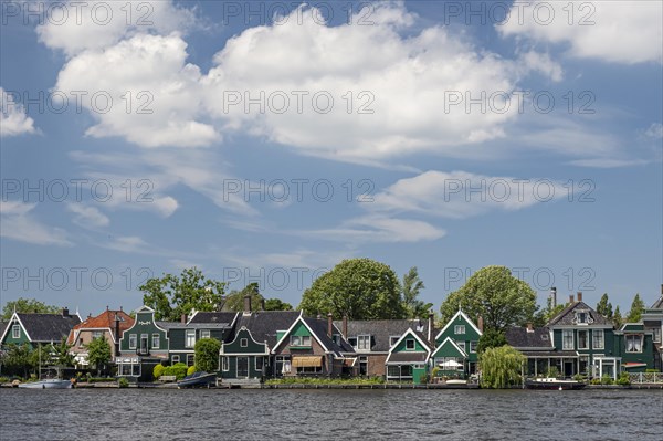 Row of houses with typical country houses on the canal