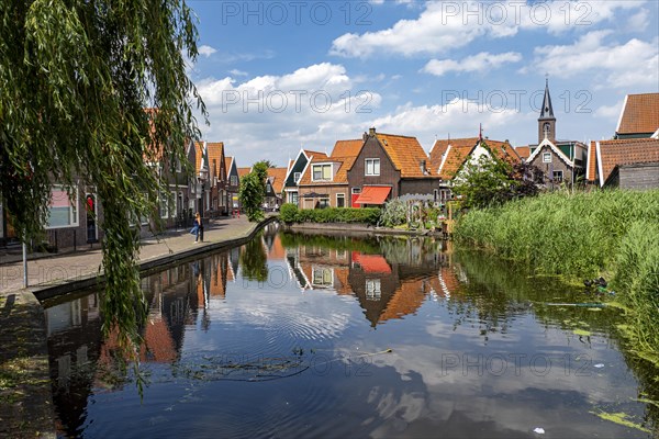 Houses on the canal and church of St. Vincentius