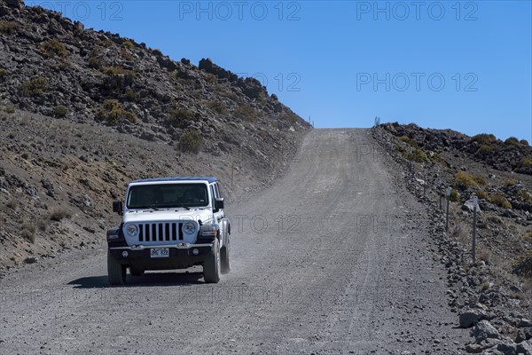 Dirt road through volcanic landscape