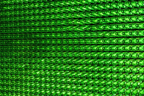 Empty green beer bottles on the conveyor belt