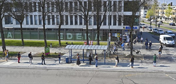 Queue in front of supermarket