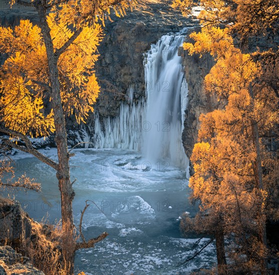 Orchon waterfall surrounded by autumnal coloured trees