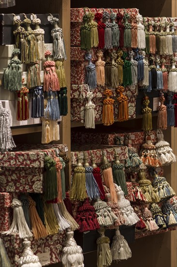 Shelf with colourful tassels