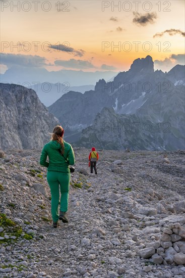 Two hikers in rocky alpine terrain