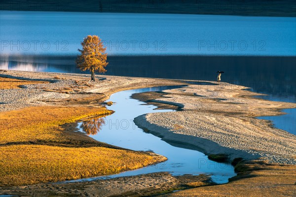 Eagle hunter on the shore of Khoton Lake