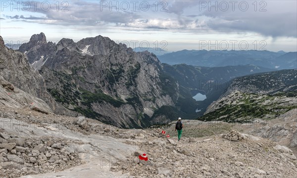 Hiker on marked hiking trail from Simonyhuette to Adamekhuette