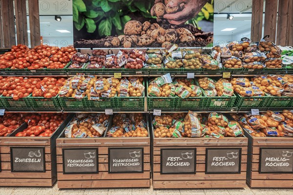 Shelf with onions and potatoes