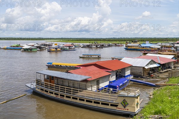 Wooden ships and floating houses in the port