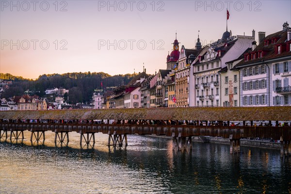 View over the river Reuss to the Chapel Bridge at sunset