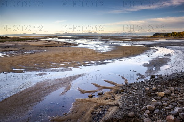 Evening mood at low tide, sand formations on the coast of Torrent Bay