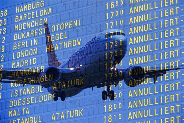 PHOTO MONTAGE, arrival and departure board at the airport