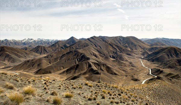 Stark mountain landscape with mountain road, Lindis Pass