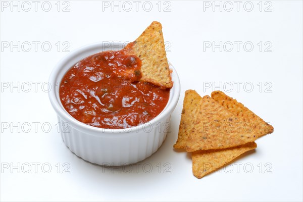 Salsa sauce in small bowls and tortilla chips, Germany
