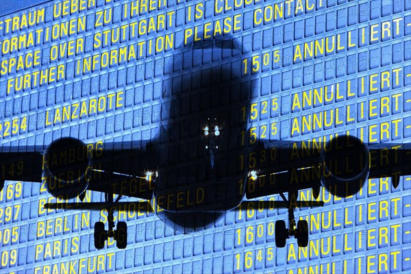 PHOTO MONTAGE, arrival and departure board at the airport