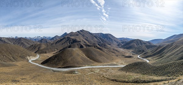 Barren mountain landscape with pass road, Lindis Pass