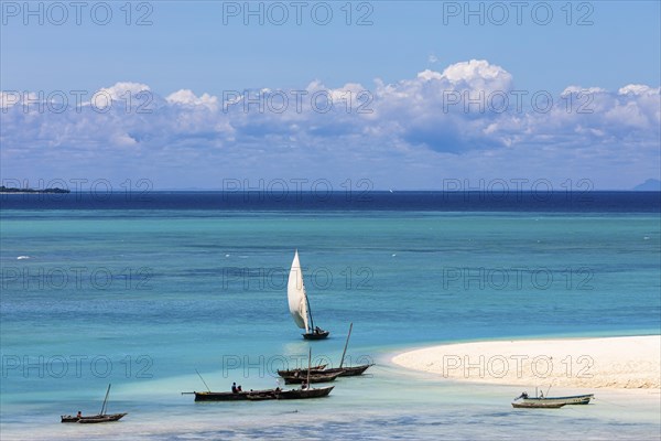 Fishing boats in turquoise green water on the beach of Kendwa, Zanzibar