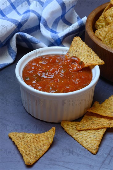 Salsa sauce in shell and tortilla chips, food photography