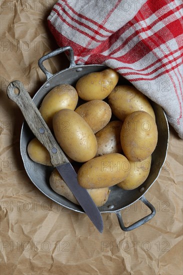 Potatoes in skin with knife, Germany