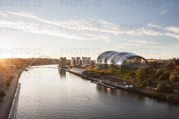 View of Sage Gateshead and the Millennium bridge from Tyne bridge at sunrise, Newcastle upon Tyne