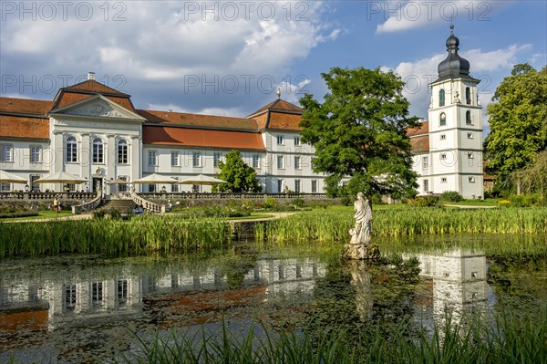 South facade with castle tower at the pond in the castle garden, baroque castle Fasanerie