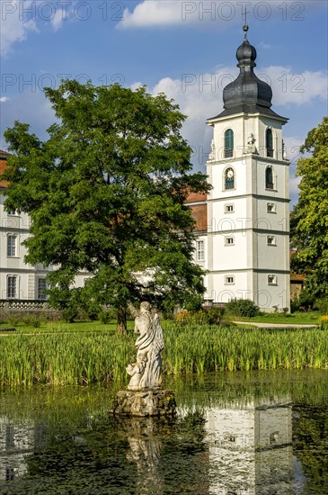 South facade with castle tower at the pond in the castle garden, baroque castle Fasanerie