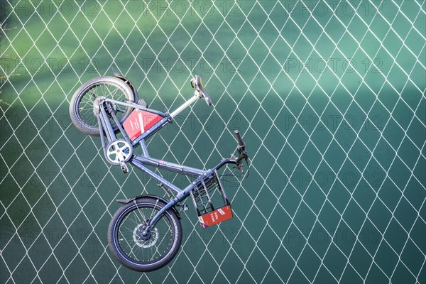 Bike of the bike sharing provider PubliBike is located on the catching net of the Kirchenfeld bridge over the Aare, bike rental