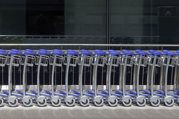 Long row of baggage trolleys at Duesseldorf airport, airport trolley