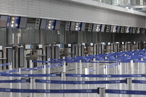 Check in counter in the deserted departure hall, Duesseldorf Airport during the Corona Pandemic