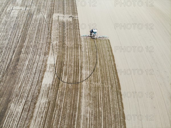 Farmer spreading liquid manure in a field, Otelfingen ZH
